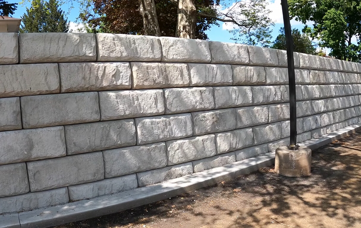Durable retaining wall and concrete masonry construction